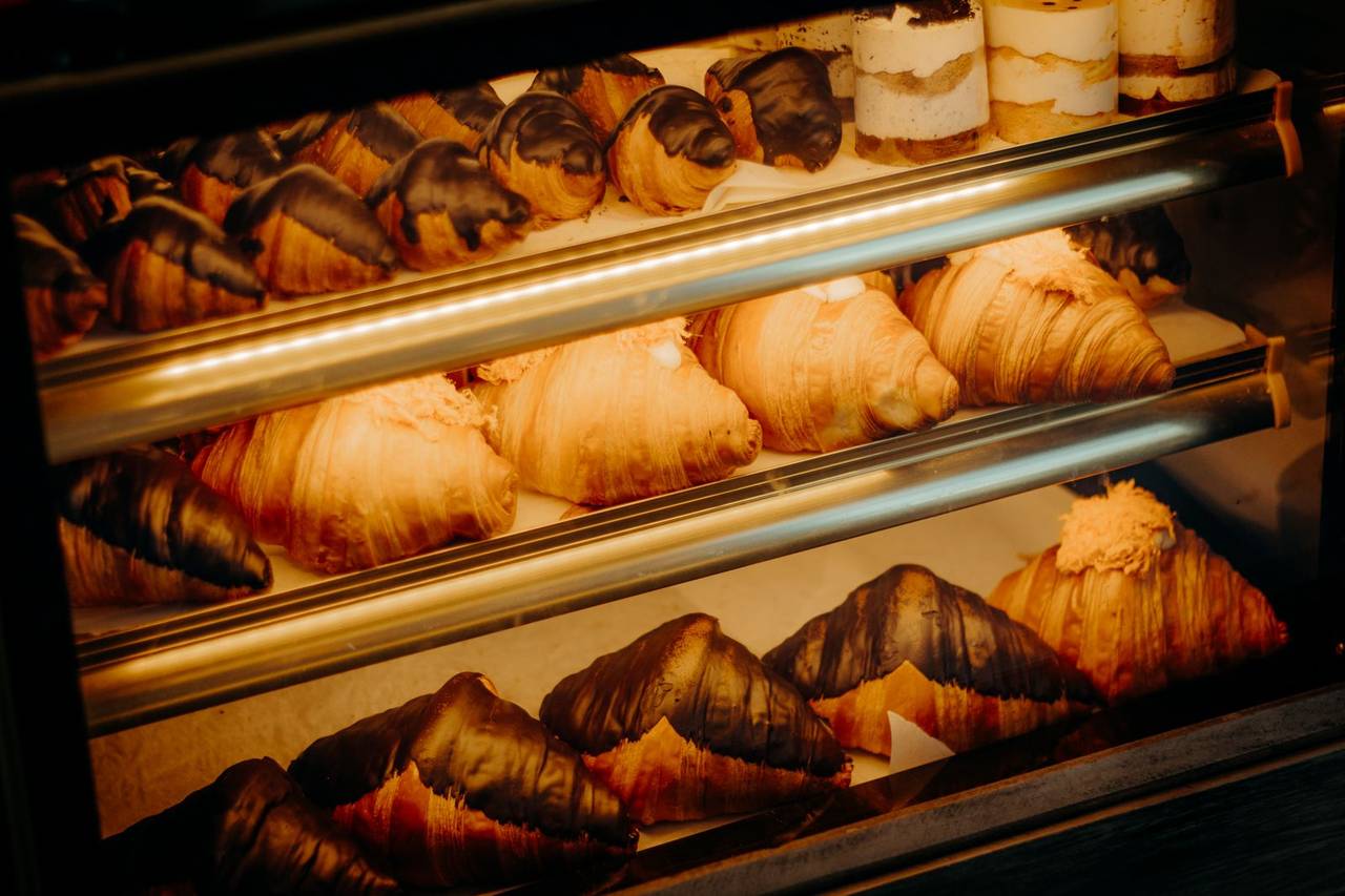 A bakery case filled with cakes and pastries