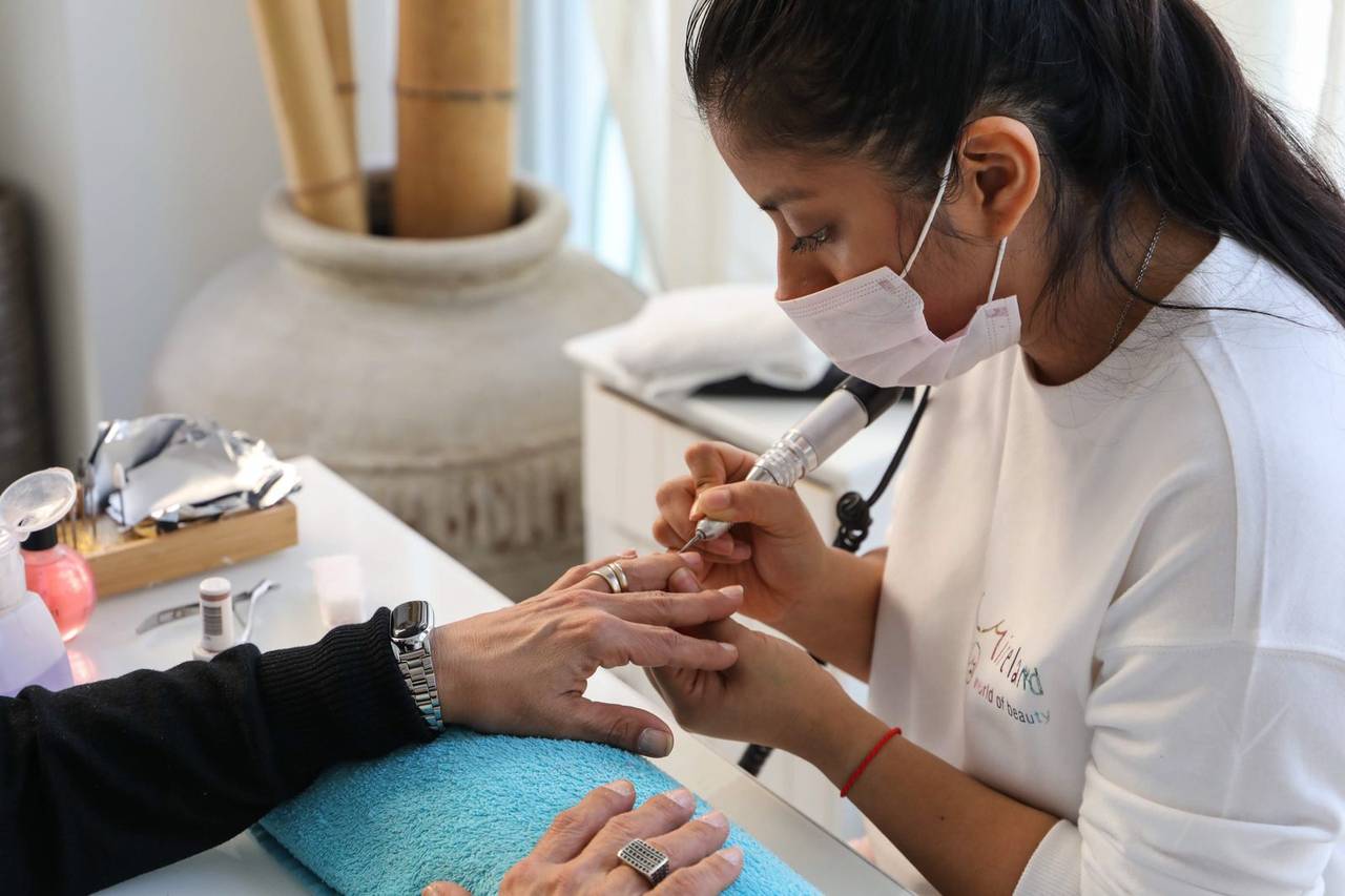 A manicure in progress at the studio table